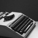 white and black typewriter close-up photography